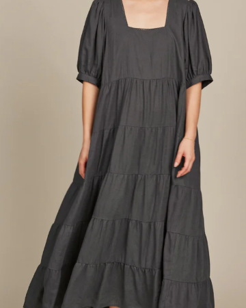 Dark hair lady in a grey dress