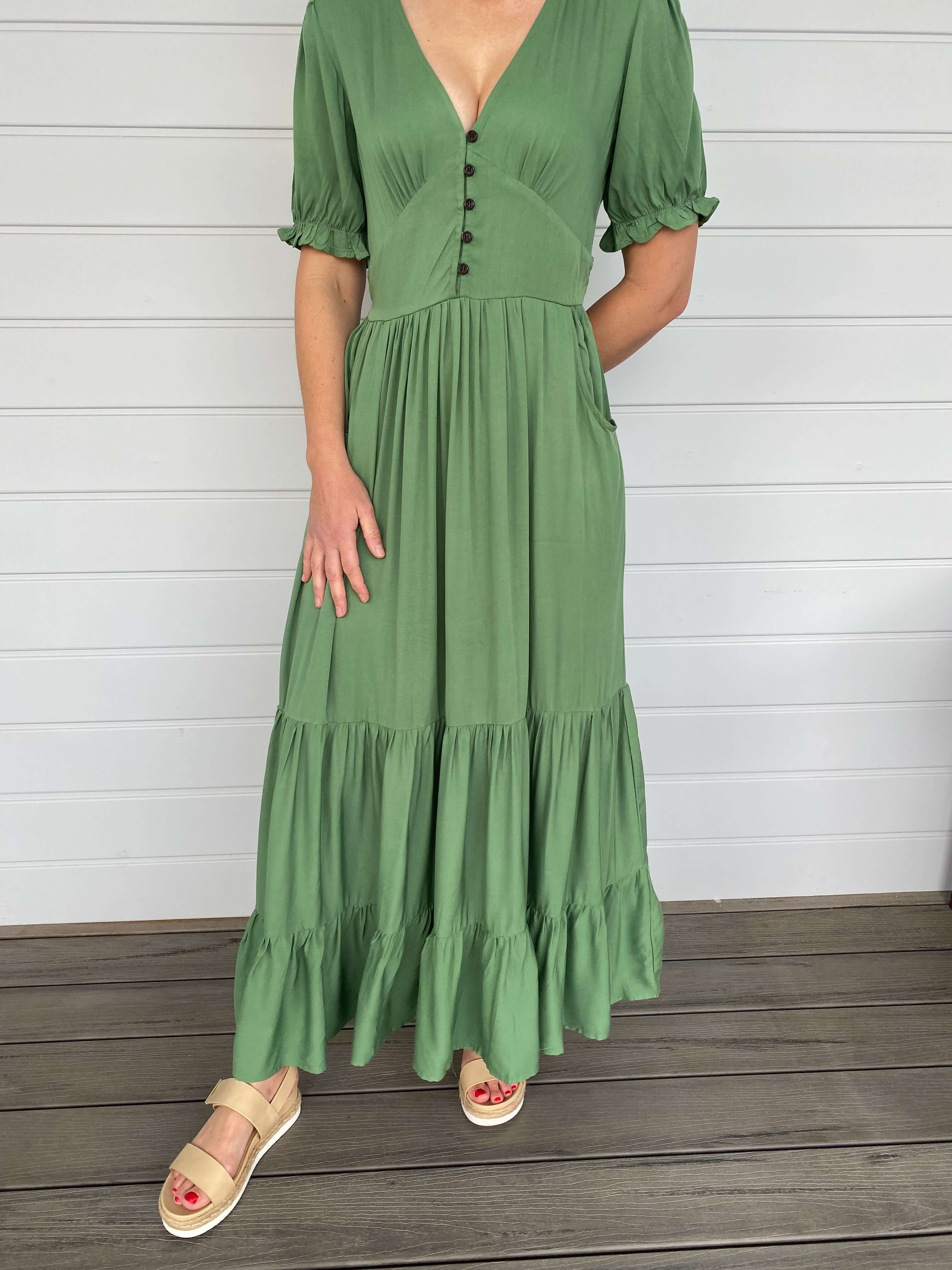 Woman in Green Olive Maxi Dress V Neck Pockets Sleeves Tired