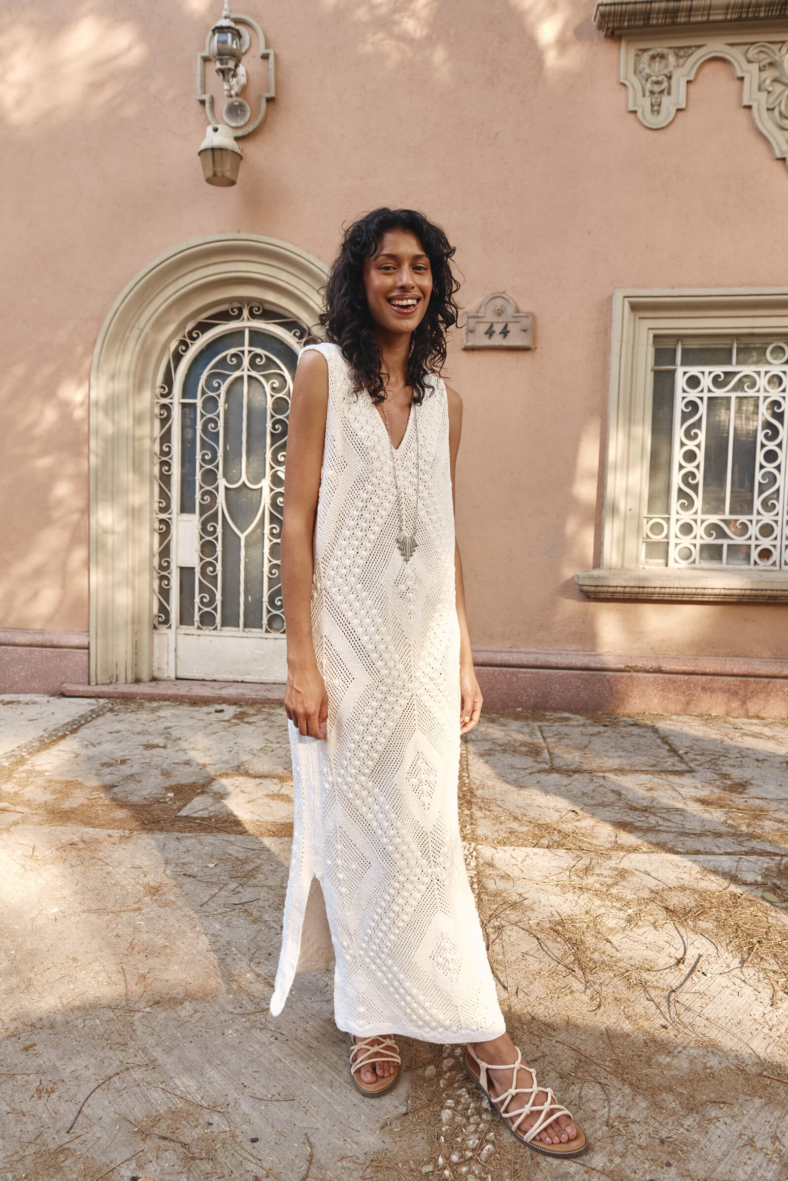 Lady in a white dress and white sandals