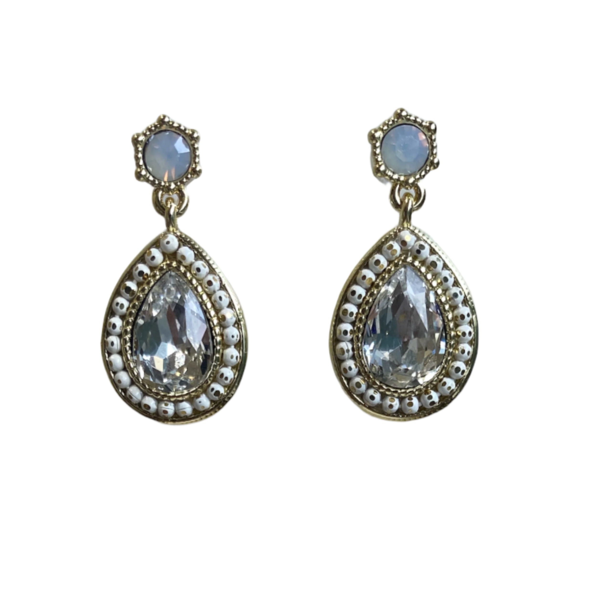 women statement earrings with clear quartz and white on a white background