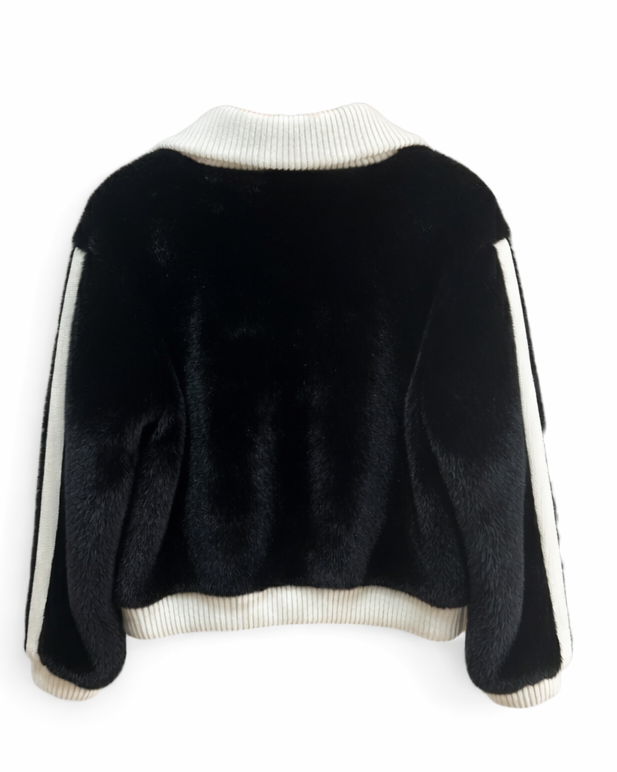 Black sweater with white trim on a white background