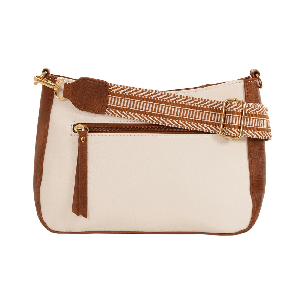 white and tan crossbody bag with white background