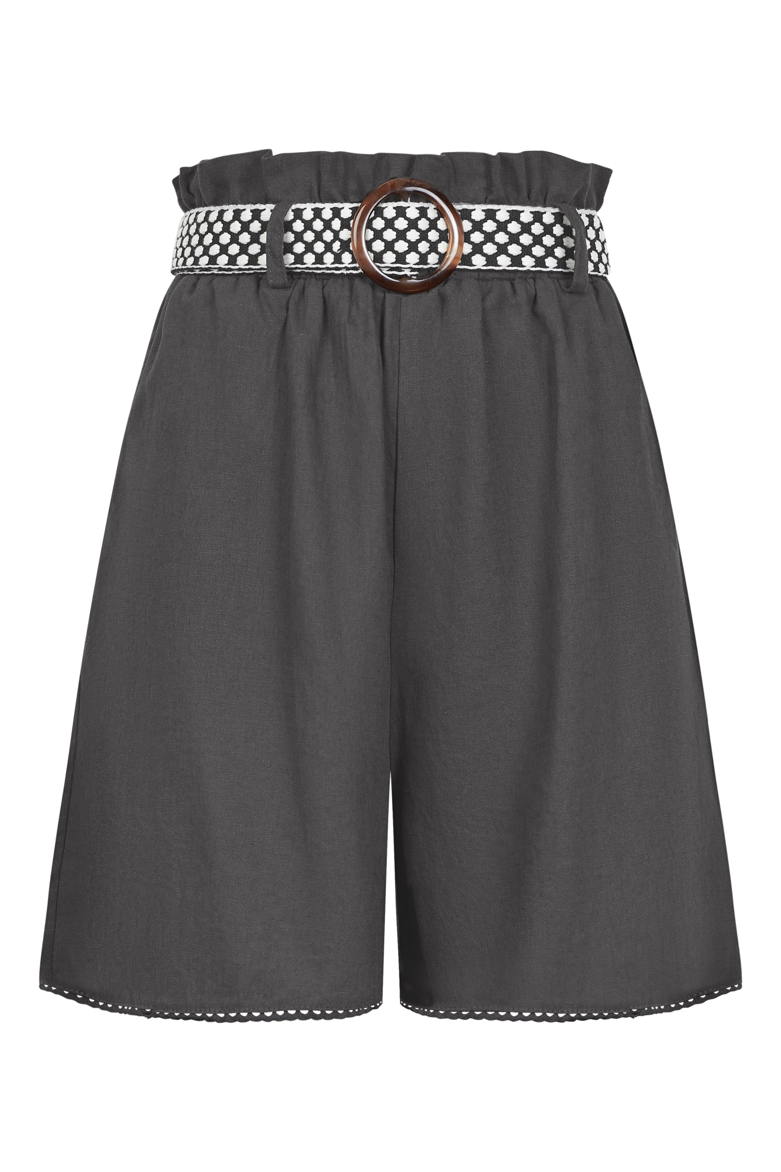 Woman in a fashionable outfit featuring a cream ribbed top and charcol grey shorts with black and white belt