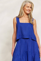 lady smiling in a blue outfit