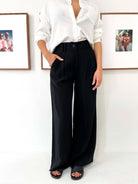 Women in Black pants and white t shirt