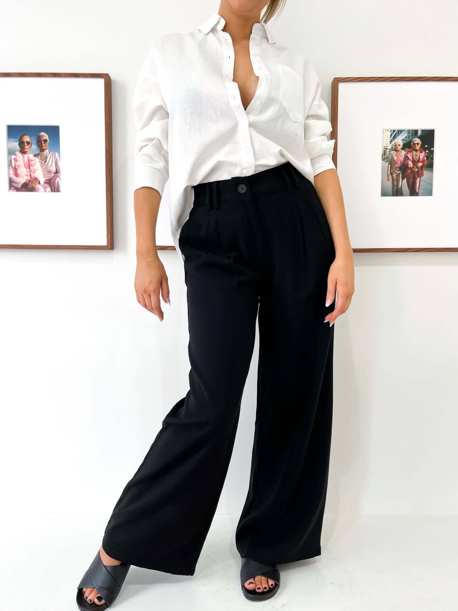 Women in Black pants and white t shirt