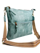 A sleek blue leather crossbody bag featuring a stylish strap for easy carrying. Perfect for everyday use!